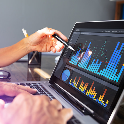 Data and analytics graphs and charts displayed on laptop