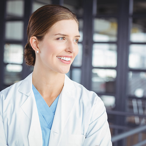 Doctor smiling and looking off camera