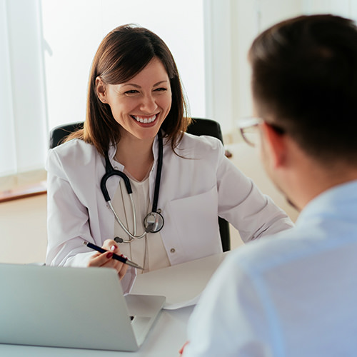 Doctor speaking to male colleague