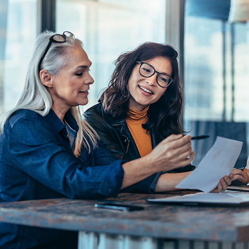 Professional woman reviewing documents and paper work