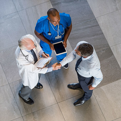 Image of a businessman and 2 doctors